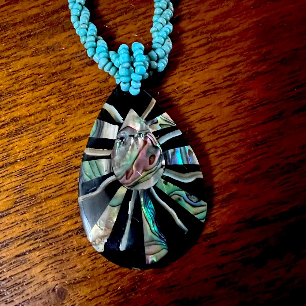 Artisan abalone and turquoise colored bead necklace.